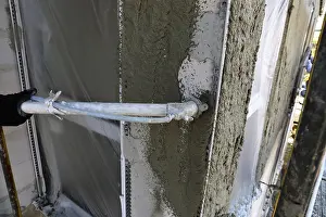 Construction Site Worker Drucke: Plasterer plastering an exterior wall