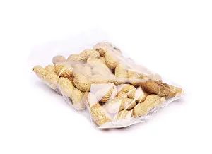 Studio Shot Of Peanuts Drucke: Plastic bag of peanuts on the white background