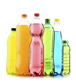 Assorted Carbonated Beverages Drucke: Plastic bottles of assorted carbonated soft drinks over white background