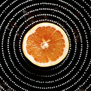 Still Life Photography Drucke: Plate with half grapefruit on the kitchen countertop