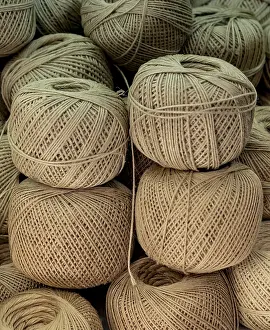 Empty Deserted Spaces Drucke: Plenty of spools or rolls of brown color linen string