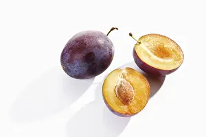 Vitamin Rich Plums Drucke: Plums, whole and halved