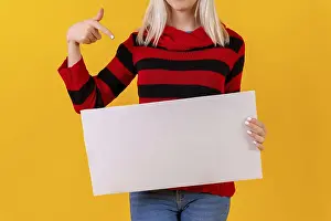 Yellow Studio Background Drucke: Pointing to an empty ad poster