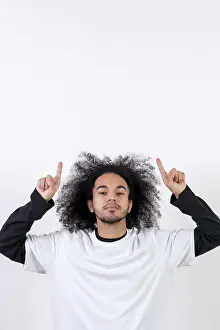 Young Man With Afro Hair Drucke: Pointing above a copy paste space