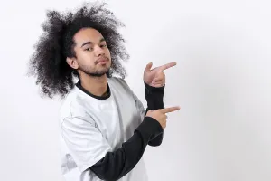 Self Confident Male Model Drucke: Pointing to the right at a copy paste space