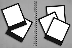 Office Supply Arrangement Drucke: Empty polaroid frames arranged around a spiral notebook on a gray background