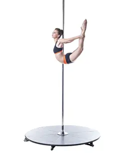 Pole Dance Drucke: Pole dance. Image of pretty girl performs complex element