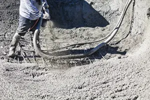 Construction Industry Workforce Drucke: Pool construction worker shooting concrete