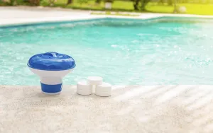 Swimming Pool Maintenance Drucke: Pool float and chlorine tablets