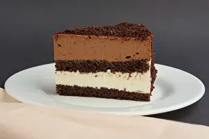 Decorative Pastry Drucke: Portion of chocolate layer cake on plate