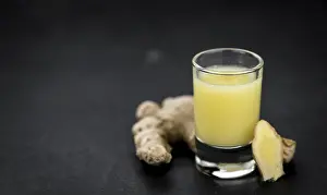 Shallow Depth Of Field Nature Shots Drucke: Portion of fresh Ginger Juice (selective focus)