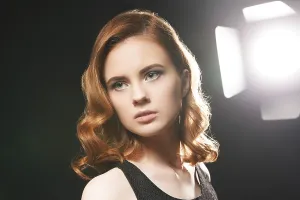 Sensual Female Head Shot Drucke: Portrait of beautiful model posing in studio on background of spotlight