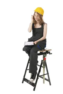 Female Construction Worker Drucke: Portrait of female builder in studio
