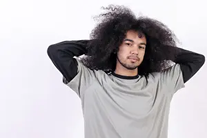 Young Adult Man Looking At Camera Drucke: Portrait stretching and waking up