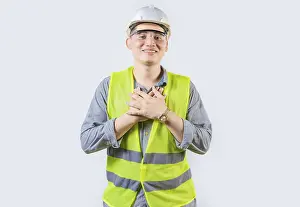 Young Construction Worker Drucke: Portrait of young engineer with grateful gesture