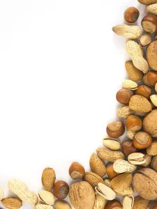 Studio Photography Of Nuts Drucke: Background of mixed nuts in shell - hazelnuts