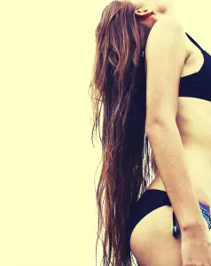 Woman In Swimsuit Drucke: Bikini girl posing outdoors enjoying summer light