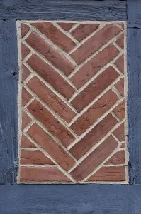 Half Timbered Construction Europe Drucke: Herringbone pattern in brick, brick-lined compartment on a historic half-timbered house in the old town of Quedlinburg