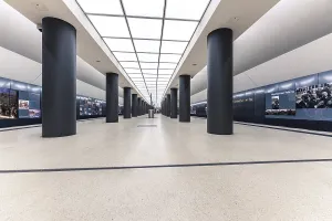 Brandenburg Gate Architecture Drucke: Modern and bright interior design of a building with a long corridor and rectangular columns
