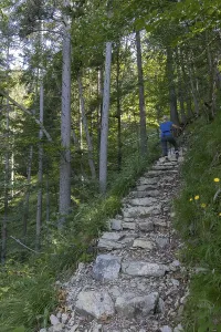 Female Hiker In The Alps Drucke: Path to the Gmail chapel, stone steps