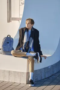 Self Confident Youth Drucke: Young student with backpack in old wool coat