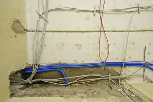 Construction Site Germany Drucke: Power cables, empty conduits and network cables under the ceiling