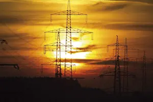 High Voltage Technology Drucke: Power masts at sunset