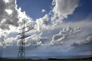 Stormy Atmosphere Drucke: Power pole with cloudy sky
