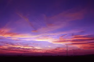 High Voltage Line Drucke: Power pole at sunset