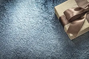 Symbolic Holiday Picture Drucke: Present box on black background copy space holidays concept