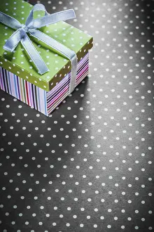 Embellished Gift Container Drucke: Present box on red tablecloth vertical image holidays concept