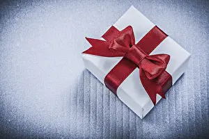 Christmas Present Drucke: Present box on white background holidays concept