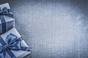 Metallic Background Concept Drucke: Two present boxes on metallic background celebrations concept