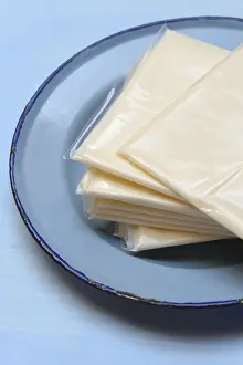 Plastic Wrapped Cheese Drucke: Processed cheese, processed cheese slices packed in plastic