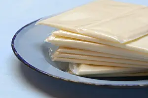 Plastic Wrapped Cheese Drucke: Processed cheese, processed cheese slices packed in plastic