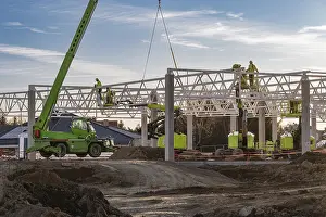 Industrial Construction Project Drucke: Professional construction crew using a telescopic handler