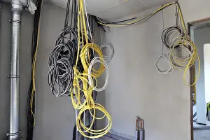 Power Distribution Box Installation Drucke: Professional electrical installation on a building shell