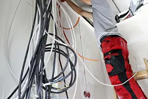 Power Distribution Box Installation Drucke: Professional electrical installation on a building shell