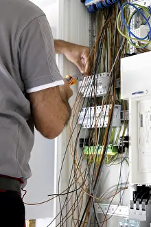 Power Distribution Box Installation Drucke: Professional electrical installation on a building shell