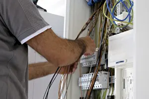 Building Shell Construction Drucke: Professional electrical installation on a building shell