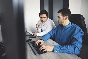 Computer Specialist Drucke: IT Programmer Working on Desktop Computer