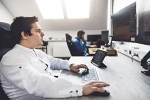 Modern Technology Drucke: IT Programmer Working on Desktop Computer