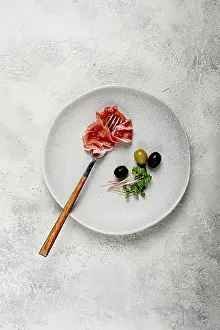 Italian Delicacy Drucke: Prosciutto on a fork, top view