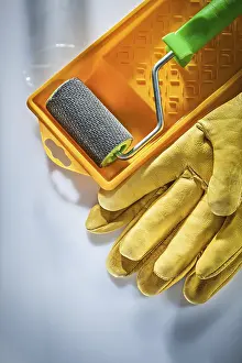 Studio Shot Isolation Drucke: Protective gloves paint tray roller on white surface