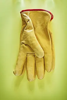 Close Up Detail Drucke: Protective gloves on yellow background