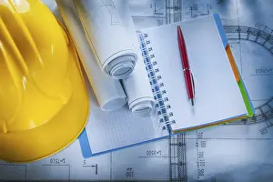 Hard Hat Safety Helmet Drucke: Protective hard hat checked notebook pen blueprints on construction plan