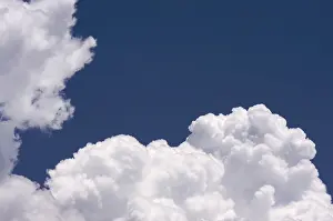 Blue Sky Drucke: Puffy clouds on a blue sky