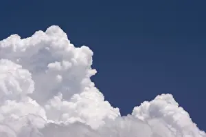 Blue Sky Drucke: Puffy clouds on a blue sky
