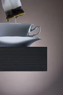 Indoor Food Photography Drucke: Pulling teabag from a cup of tea