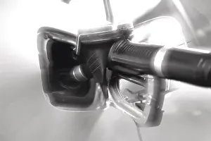 Deserted Gas Station Scene Drucke: Pump nozzle in tank